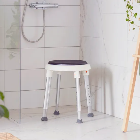 Etac Easy shower stool (grey) with swivel pad in use